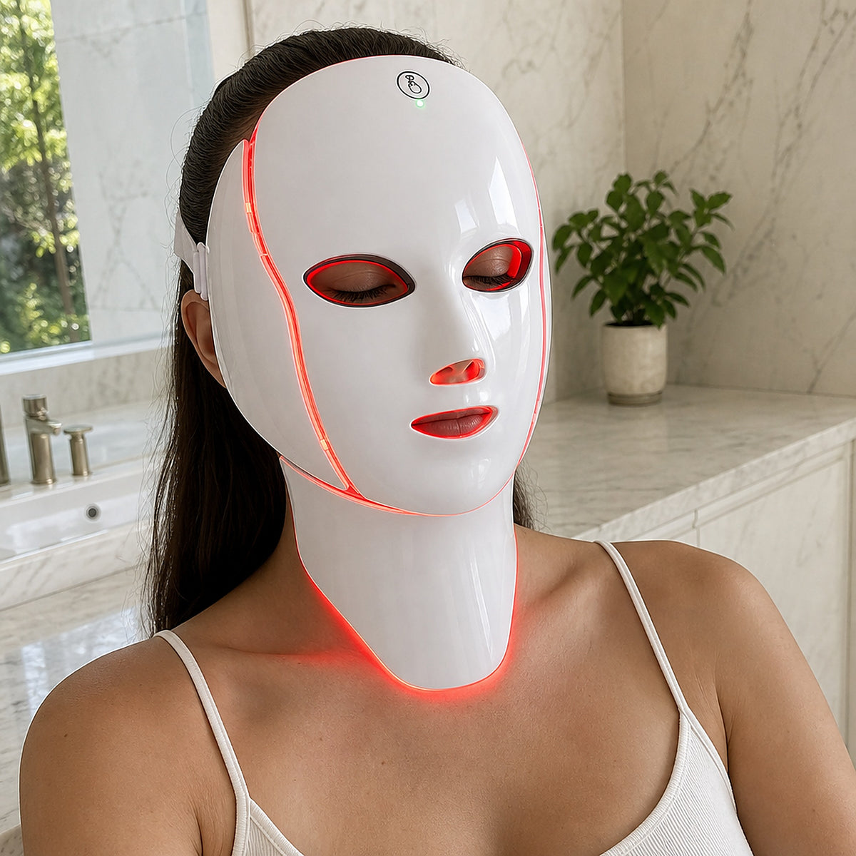 Woman testing the Velora LED face and neck mask